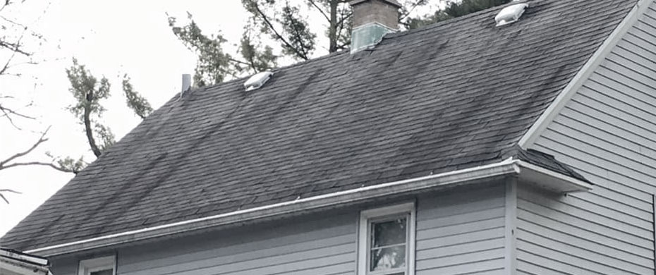 dirty black streaks on roof shingles